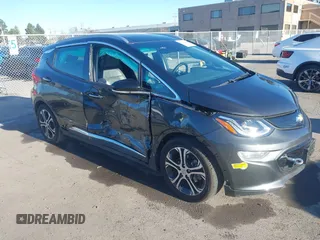 2021 Chevrolet Bolt EV Premier z VIN 1G1FZ6S08M4103819, wystawiony jako IAAI lot #41266469 z przebiegiem 25 513 mil mil oraz . Historia ofert i sprzedaży dostępna na DreamBid. Obrazek 1.