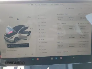 2023 Tesla Model Y Long Range z VIN 7SAYGDEE5PF785124, wystawiony jako Copart lot #56553785 z przebiegiem 31 341 mil mil oraz Szkoda całkowita • Salvage title. Historia ofert i sprzedaży dostępna na DreamBid. Obrazek 9.