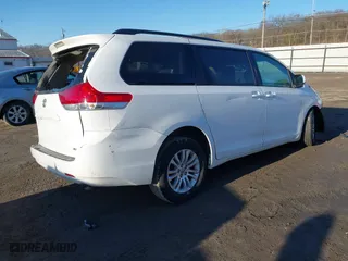 2013 Toyota Sienna XLE AAS with VIN 5TDYK3DC8DS402418, listed as a IAAI auction lot 41752030 with 193,390 mi miles. Bid and sale history available at carsss.com. Image 4.