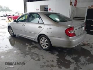 2002 Toyota Camry XLE z VIN 4T1BF30K32U009695, wystawiony jako IAAI lot #42376626 z przebiegiem 291 800 mil mil oraz . Historia ofert i sprzedaży dostępna na DreamBid. Obrazek 3.