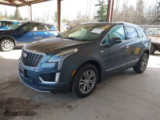 2021 Cadillac XT5 AWD Premium Luxury with VIN 1GYKNDRS3MZ139802, listed as a IAAI auction lot 41698772 with 62,886 mi miles. Bid and sale history available at carsss.com. Image 2.