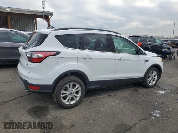 2018 Ford Escape SE z VIN 1FMCU9GD5JUB12877, wystawiony jako Copart lot #51973295 z przebiegiem 121 698 mil mil oraz Szkoda całkowita • Salvage title. Historia ofert i sprzedaży dostępna na DreamBid. Obrazek 3.