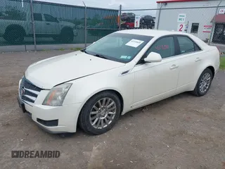 2009 Cadillac CTS RWD with VIN 1G6DF577290173180, listed as a IAAI auction lot 42376810 with 135,111 mi miles and . Bid and sale history available at DreamBid. Image 2.