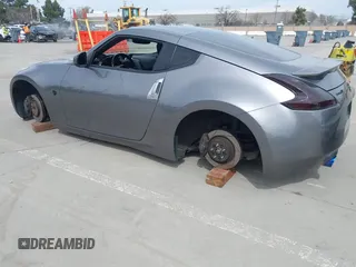 2012 Nissan 370Z Touring with VIN JN1AZ4EH4CM561415, listed as a IAAI auction lot 41838948 with 111,298 mi miles. Bid and sale history available at carsss.com. Image 3.