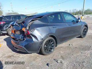 2021 Tesla Model Y Long Range with VIN 5YJYGAEE1MF149887, listed as a IAAI auction lot 42032104 with 54,932 mi miles. Bid and sale history available at carsss.com. Image 4.