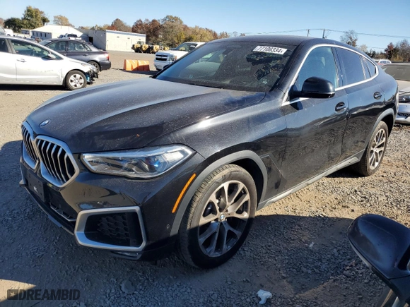 2021 BMW X6 xDrive40i with VIN 5UXCY6C07M9D94944, listed as a Copart auction lot 77106334 with 52,106 mi miles and Salvage Title. Bid and sale history available at carsss.com. Image 1.