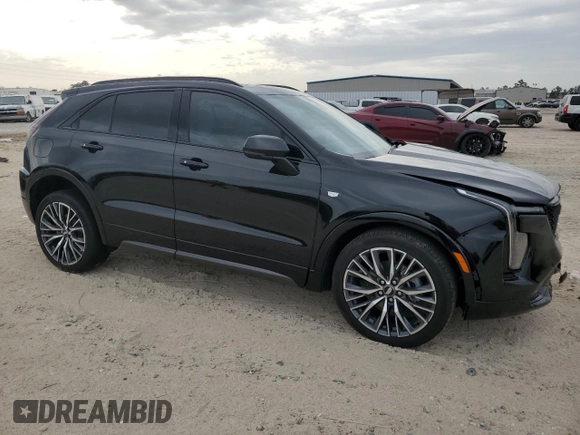 2024 Cadillac XT4 FWD Sport with VIN 1GYFZER46RF213543, listed as a Copart auction lot 83609754 with 3,878 mi miles and Salvage title. Bid and sale history available at DreamBid. Image 4.