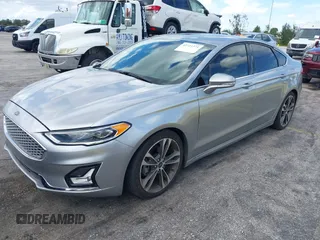 2020 Ford Fusion Titanium with VIN 3FA6P0D95LR199443, listed as a IAAI auction lot 42721371 with 77,592 mi miles and . Bid and sale history available at DreamBid. Image 19.