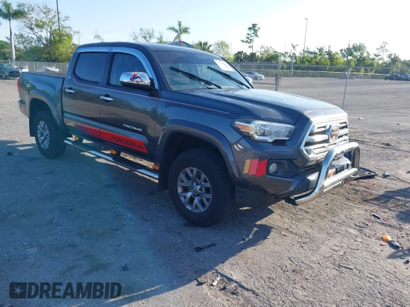 2018 Toyota Tacoma SR5 with VIN 3TMAZ5CN4JM069965, listed as a IAAI auction lot 41798238 with 124,619 mi miles and . Bid and sale history available at DreamBid. Image 1.