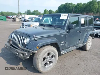 2017 Jeep Wrangler Unlimited Sahara with VIN 1C4BJWEG4HL518945, listed as a IAAI auction lot 42423505 with 155,828 mi miles and . Bid and sale history available at DreamBid. Image 2.