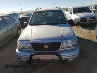 2003 Suzuki Vitara z VIN 2S3TE52V936103483, wystawiony jako Copart lot #82235884 z przebiegiem 173 354 mil mil oraz Szkody całkowita. Historia ofert i sprzedaży dostępna na DreamBid. Obrazek 5.