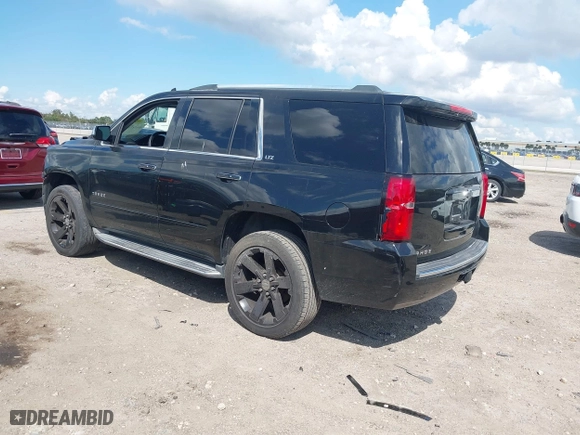 2015 Chevrolet Tahoe LTZ with VIN 1GNSCCKC7FR746028, listed as a IAAI auction lot 41674775 with 198,067 mi miles. Bid and sale history available at carsss.com. Image 3.