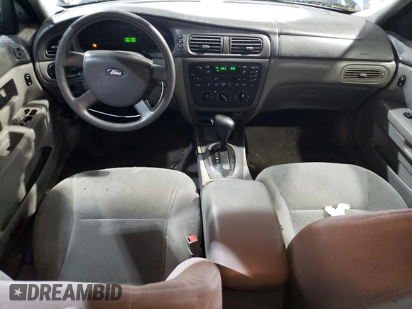 2004 Ford Taurus SE z VIN 1FAFP532X4A187754, wystawiony jako Copart lot #51262185 z przebiegiem 121 663 mil mil oraz Szkoda całkowita • Salvage title. Historia ofert i sprzedaży dostępna na DreamBid. Obrazek 8.
