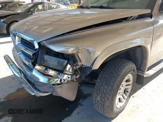 2003 Dodge Dakota SLT with VIN 1D7HG48N03S344321, listed as a IAAI auction lot 42074421 with 96,489 mi miles and . Bid and sale history available at carsss.com. Image 6.