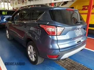 2018 Ford Escape SE z VIN 1FMCU9GD2JUA75853, wystawiony jako IAAI lot #42399997 z przebiegiem 89 772 mil mil oraz . Historia ofert i sprzedaży dostępna na DreamBid. Obrazek 9.