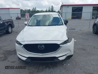 2018 Mazda CX-5 Touring z VIN JM3KFACM6J1419663, wystawiony jako IAAI lot #41879677 z przebiegiem 115 224 mil mil oraz . Historia ofert i sprzedaży dostępna na DreamBid. Obrazek 12.