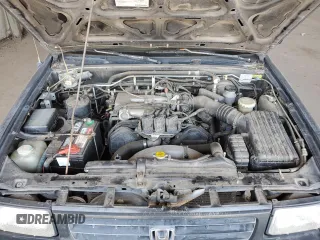 1995 Honda Passport z VIN 4S6CY58V4S4406803, wystawiony jako Copart lot #73057084 z przebiegiem 161 118 mil mil oraz Szkody całkowita. Historia ofert i sprzedaży dostępna na DreamBid. Obrazek 11.