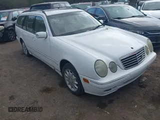 2001 Mercedes-Benz E-Class AWD with VIN WDBJH82J61X057506, listed as a IAAI auction lot 41506666 with 304,332 mi miles. Bid and sale history available at carsss.com. Image 1.