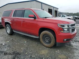 2015 Chevrolet Suburban LT with VIN 1GNSCJKC2FR306223, listed as a Copart auction lot 58733475 with 191,330 mi miles and Salvage title. Bid and sale history available at DreamBid. Image 4.