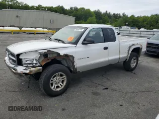 2001 Dodge Dakota Sport z VIN 1B7GG22N31S313385, wystawiony jako Copart lot #58492085 z przebiegiem 236 939 mil mil oraz Czysty tytuł • Clean title. Historia ofert i sprzedaży dostępna na DreamBid. Obrazek 1.