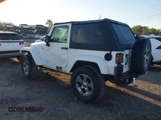 2018 Jeep Wrangler Sahara with VIN 1C4AJWBG2JL821132, listed as a IAAI auction lot 42523688 with 86,244 mi miles and . Bid and sale history available at DreamBid. Image 3.