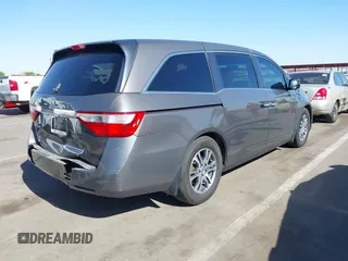 2011 Honda Odyssey EX-L with VIN 5FNRL5H6XBB083980, listed as a IAAI auction lot 42100308 with 191,361 mi miles and . Bid and sale history available at carsss.com. Image 4.