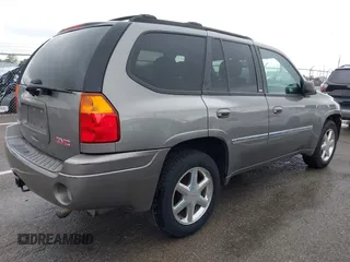 2008 GMC Envoy SLE2 with VIN 1GKDT13S482244279, listed as a IAAI auction lot 42144735 with 221,682 mi miles. Bid and sale history available at carsss.com. Image 4.