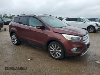 2018 Ford Escape Titanium z VIN 1FMCU0J93JUA70449, wystawiony jako Copart lot #59303245 z przebiegiem 165 907 mil mil oraz Szkoda całkowita • Salvage title. Historia ofert i sprzedaży dostępna na DreamBid. Obrazek 4.