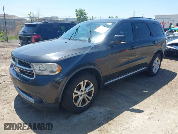 2011 Dodge Durango Crew with VIN 1D4RE4GG4BC599282, listed as a IAAI auction lot 42228048 with 150,514 mi miles and . Bid and sale history available at carsss.com. Image 2.