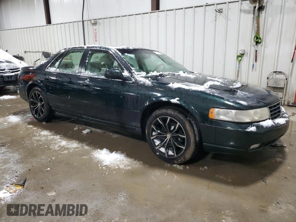 2000 Cadillac Seville Touring STS z VIN 1G6KY5494YU220613, wystawiony jako Copart lot #87338724 z przebiegiem 106 313 mil mil oraz Szkoda całkowita • Salvage title. Historia ofert i sprzedaży dostępna na DreamBid. Obrazek 4.