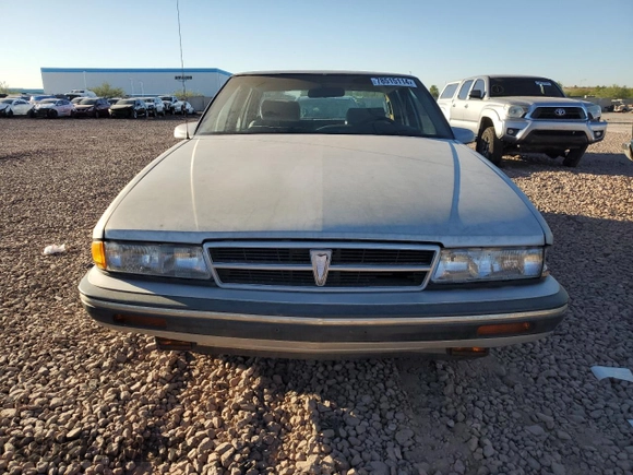 1988 Pontiac Bonneville с VIN 1G2HZ54C1JW300580, выставлен на аукционе Copart как лот 78515114 с пробегом 191 243 миль миль и Чистый • Clean title. История ставок и продаж доступна на DreamBid. Изображение 5.