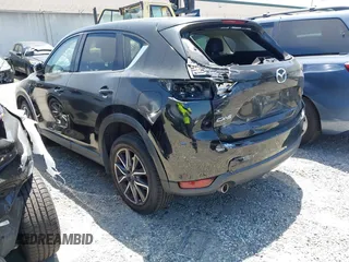 2018 Mazda CX-5 Grand Touring with VIN JM3KFADM4J0326760, listed as a IAAI auction lot 41885100 with 82,091 mi miles and . Bid and sale history available at DreamBid. Image 3.