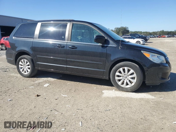 2014 Volkswagen Routan SE with VIN 2C4RVABG9ER135273, listed as a Copart auction lot 45343575 with 94,528 mi miles and Salvage title. Bid and sale history available at DreamBid. Image 4.
