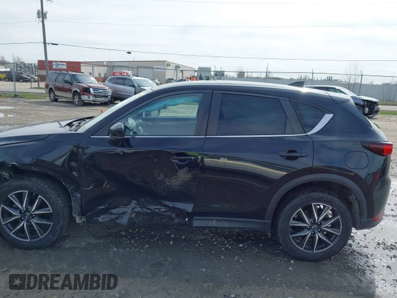 2018 Mazda CX-5 Touring with VIN JM3KFBCMXJ0438177, listed as a IAAI auction lot 42152275 with 65,434 mi miles and . Bid and sale history available at carsss.com. Image 14.