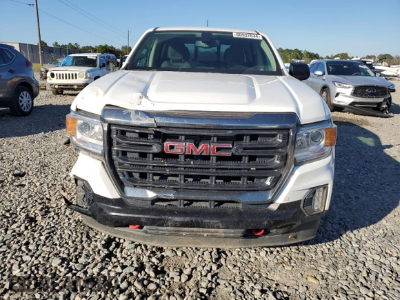 2021 GMC Canyon 4WD AT4 w/Cloth with VIN 1GTG6FEN9M1216062, listed as a Copart auction lot 80932634 with 73,308 mi miles and Salvage Title. Bid and sale history available at carsss.com. Image 5.