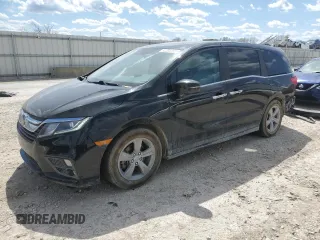 2018 Honda Odyssey EX-L with VIN 5FNRL6H77JB009851, listed as a Copart auction lot 52203155 with 127,575 mi miles and Salvage Title. Bid and sale history available at carsss.com. Image 1.