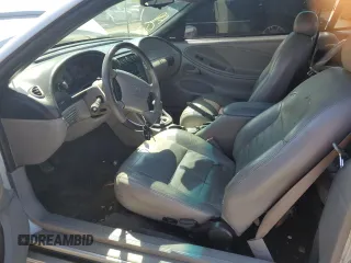 1999 Ford Mustang with VIN 1FAFP4448XF233101, listed as a Copart auction lot 54701005 with 54,585 mi miles and Salvage title. Bid and sale history available at DreamBid. Image 7.