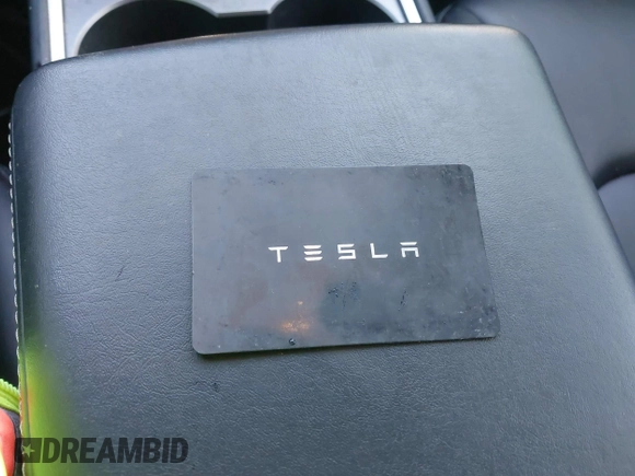 2022 Tesla Model Y Long Range with VIN 7SAYGAEE6NF361883, listed as a IAAI auction lot 41752441 with 50,493 mi miles and . Bid and sale history available at DreamBid. Image 11.