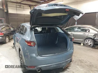 2021 Mazda CX-5 Touring with VIN JM3KFBCM5M0365725, listed as a IAAI auction lot 41411763 with 77,504 mi miles. Bid and sale history available at carsss.com. Image 3.