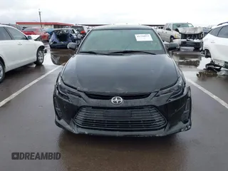 2015 Scion tC with VIN JTKJF5C79FJ003404, listed as a IAAI auction lot 41756024 with 128,906 mi miles. Bid and sale history available at carsss.com. Image 12.
