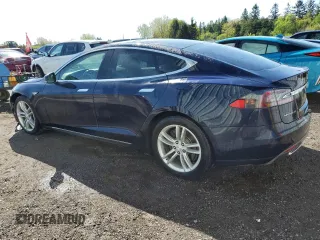 2014 Tesla Model S 60 z VIN 5YJSA1H10EFP35319, wystawiony jako Copart lot #53868745 z przebiegiem 209 424 mil mil oraz Szkoda całkowita • Salvage title. Historia ofert i sprzedaży dostępna na DreamBid. Obrazek 2.