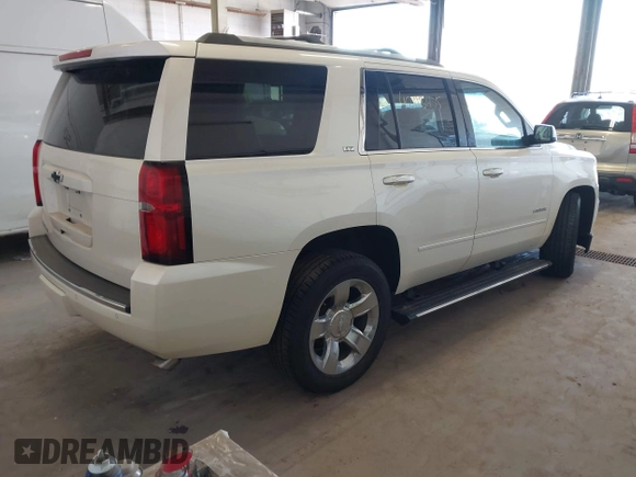 2015 Chevrolet Tahoe LTZ with VIN 1GNSKCKC9FR123996, listed as a IAAI auction lot 42113435 with 149,825 mi miles and . Bid and sale history available at DreamBid. Image 4.