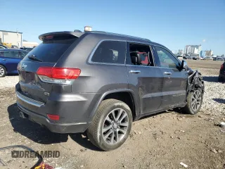 2017 Jeep Grand Cherokee Overland with VIN 1C4RJFCG0HC762612, listed as a Copart auction lot 57400095 with 122,702 mi miles and Salvage title. Bid and sale history available at DreamBid. Image 3.