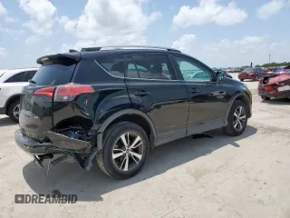 2018 Toyota RAV4 XLE with VIN 2T3WFREV2JW433186, listed as a Copart auction lot 61008705 with 57,310 mi miles and Salvage title. Bid and sale history available at DreamBid. Image 3.