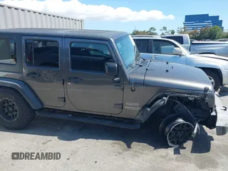 2016 Jeep Wrangler Unlimited Sport z VIN 1C4BJWDG7GL229364, wystawiony jako IAAI lot #42239069 z przebiegiem 87 001 mil mil oraz . Historia ofert i sprzedaży dostępna na DreamBid. Obrazek 13.