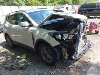 2017 Hyundai Santa Fe 2.4L z VIN 5XYZUDLB3HG441370, wystawiony jako IAAI lot #42388929 z przebiegiem 97 441 mil mil oraz . Historia ofert i sprzedaży dostępna na DreamBid. Obrazek 1.