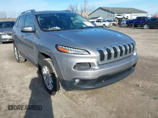 2014 Jeep Cherokee Latitude with VIN 1C4PJMCSXEW125737, listed as a IAAI auction lot 41863778 with 120,226 mi miles. Bid and sale history available at carsss.com. Image 1.