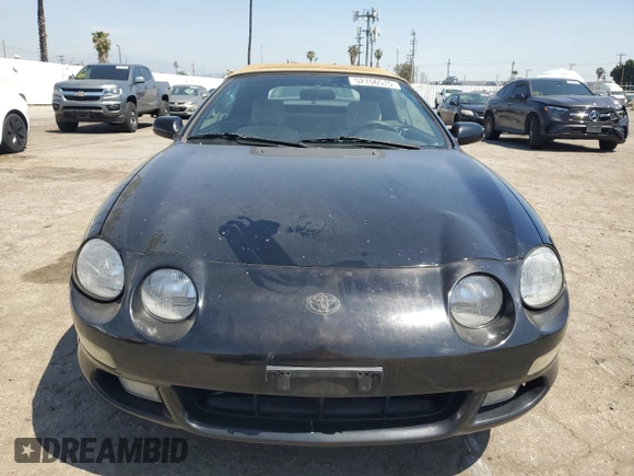 1997 Toyota Celica GT z VIN JT5FG02TXV0044202, wystawiony jako Copart lot #52166575 z przebiegiem 167 292 mil mil oraz Szkoda całkowita • Salvage title. Historia ofert i sprzedaży dostępna na DreamBid. Obrazek 5.