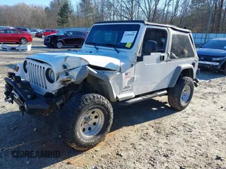 2005 Jeep Wrangler Unlimited with VIN 1J4FA44SX5P316055, listed as a IAAI auction lot 41586898 with 218,181 mi miles. Bid and sale history available at carsss.com. Image 17.