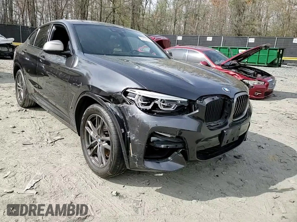 2019 BMW X4 M40i with VIN 5UXUJ5C5XKLJ64004, listed as a Copart auction lot 52106895 with 74,599 mi miles and Salvage title. Bid and sale history available at DreamBid. Image 11.